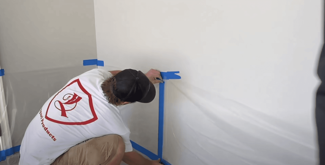 As we prepare for staining, we put plastic up all around the garage to protect the walls.