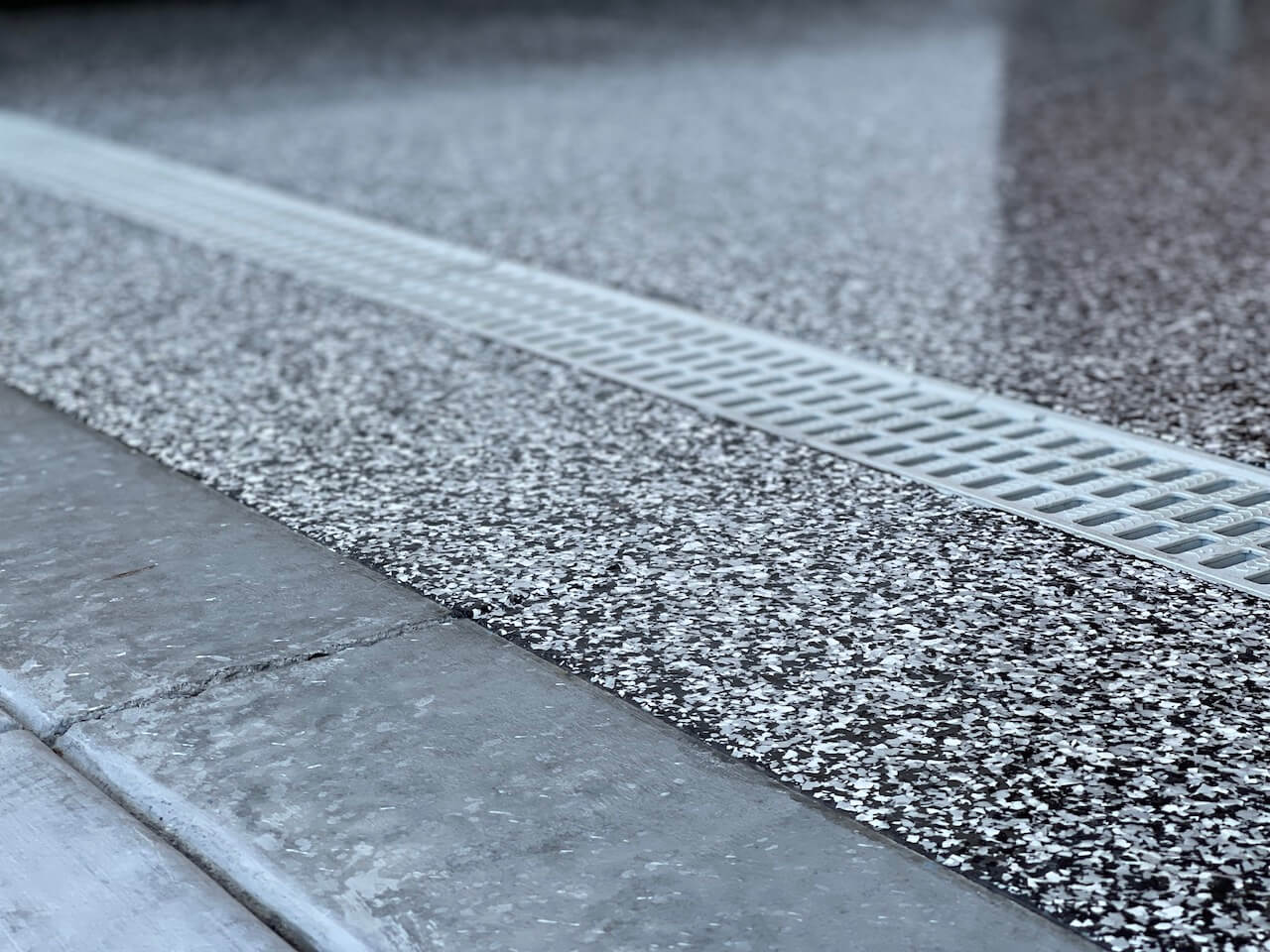 An epoxy flake garage floor with gorgeous black and white chips.